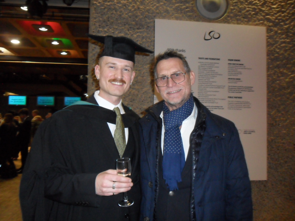 Axel Valberg on graduation day, wearing a cap and gown. 